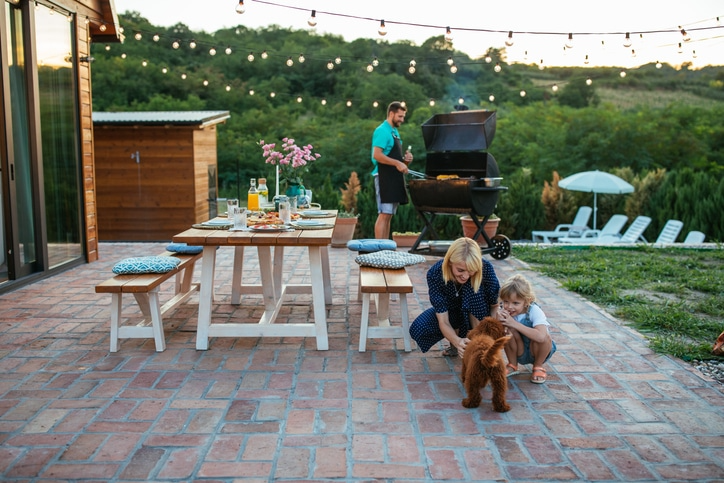 A family enjoys a backyard barbecue