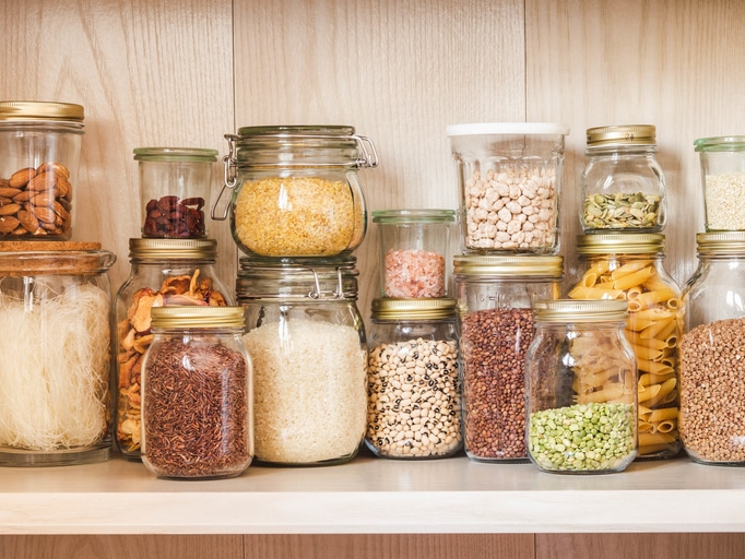 shelf full of clear glass jars
